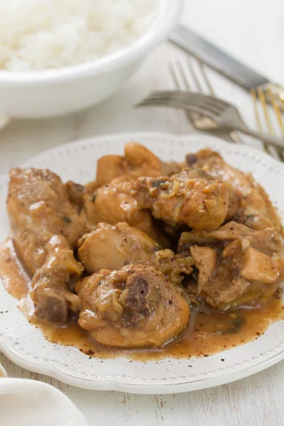 Boiled chicken with beer sauce in white plate — Stock Photo, Image