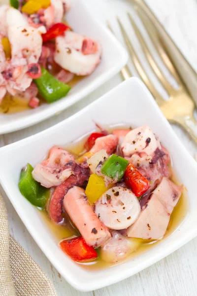 Salad with octopus in bowl — Stock Photo, Image
