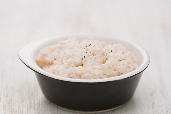 Fish pate on black dish — Stock Photo, Image