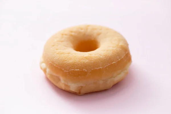 Ein Donut Auf Rosa Hintergrund — Stockfoto