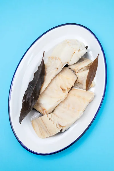 Boiled Cod Fish Bay Leaf White Dish Blue Background — Stock Photo, Image