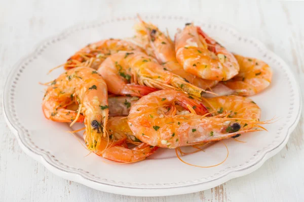 Shrimps on white plate — Stock Photo, Image