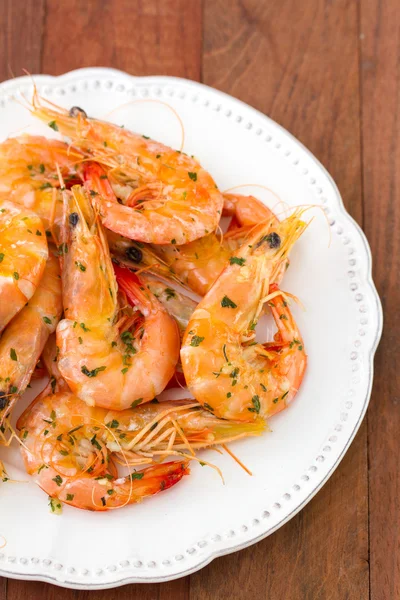 Shrimps on white plate — Stock Photo, Image