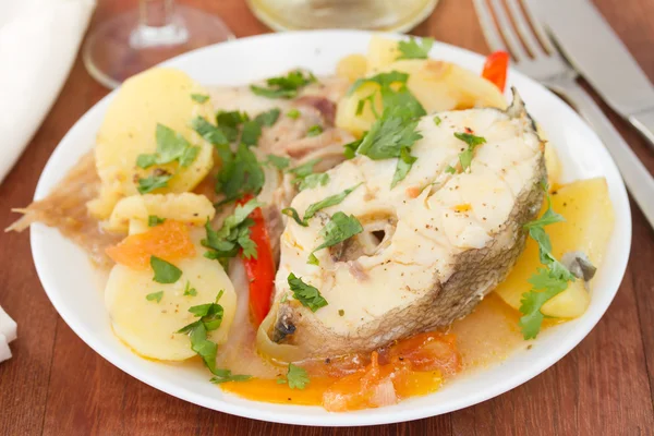 Fish stew on white plate — Stock Photo, Image