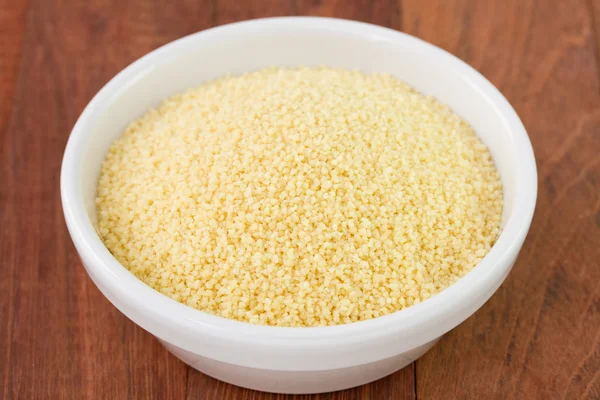 Couscous in white bowl — Stock Photo, Image