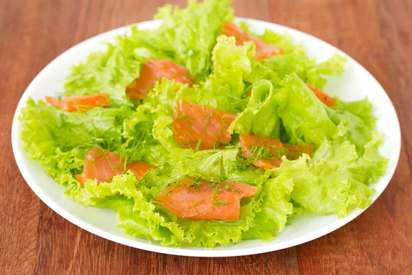 Salad with salted salmon on plate — Stock Photo, Image