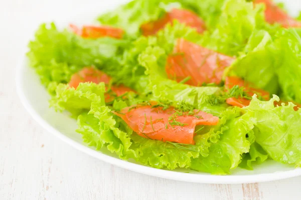 Salad with salted salmon on plate — Stock Photo, Image