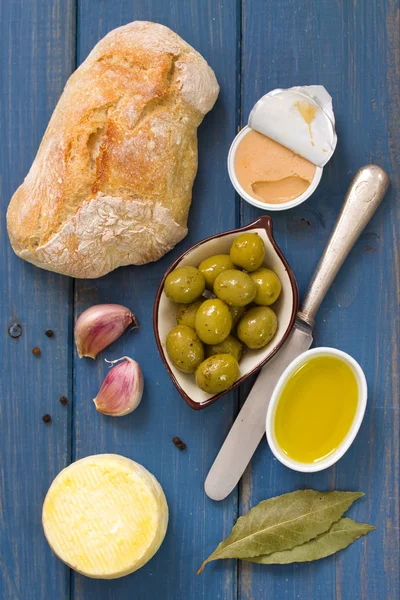 Bread with olives, pate and olive oil — Stock Photo, Image