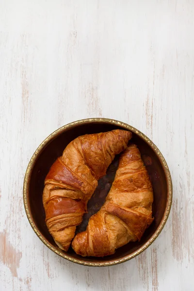 Croissants in dish on white background — Stock Photo, Image