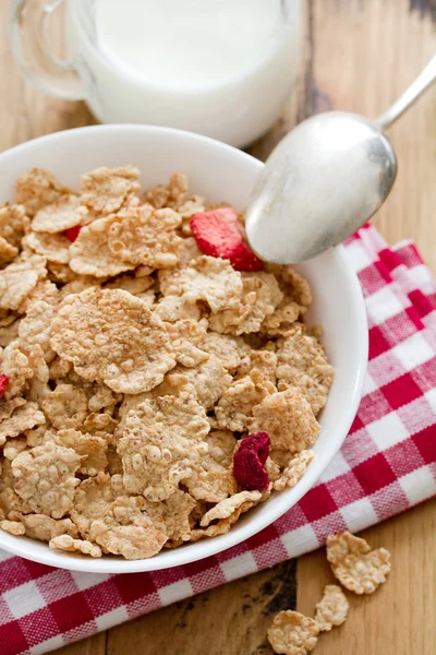 Cereals with dry fruits in white bowl and milk — Stock Photo, Image