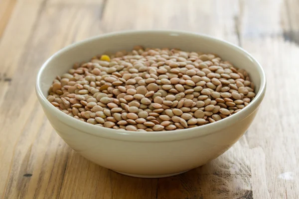 Dry lentil in bowl — Stock Photo, Image