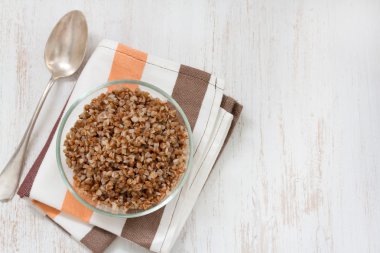 Buckwheat in bowl with spoon