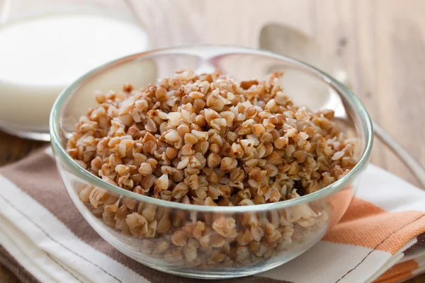 Buckwheat in bowl with spoon — Stock fotografie