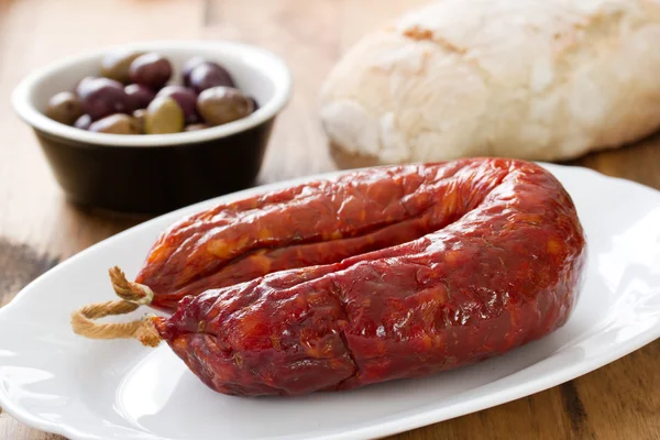 Chorizo on dish on white dish — Φωτογραφία Αρχείου