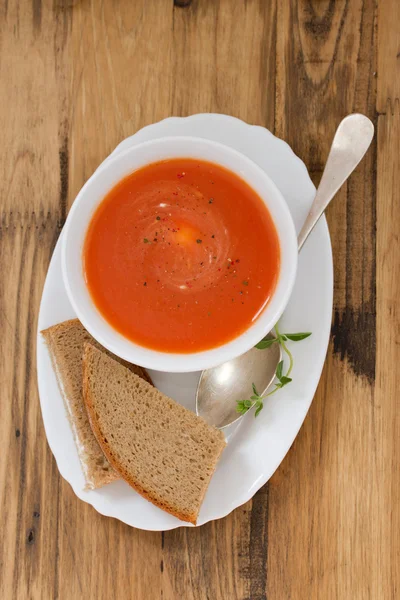 Tomato soup in white bowl with sandwich — Stock Photo, Image