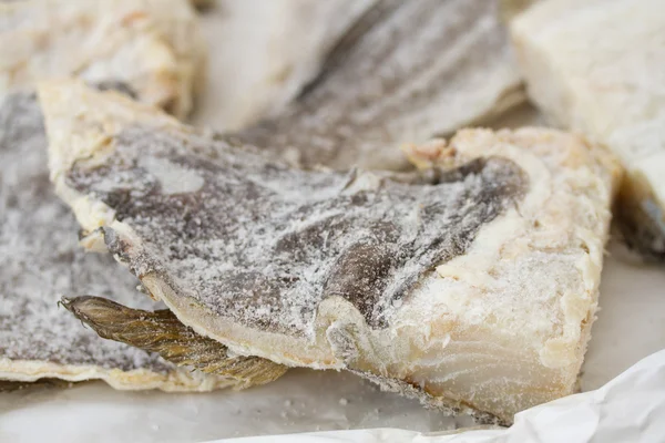 Salted codfish on paper — Stock Photo, Image