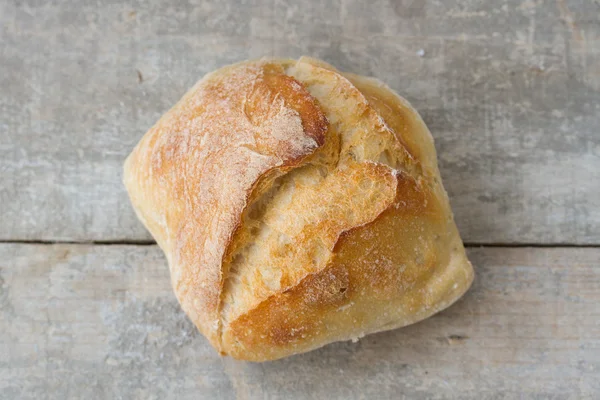 Bread on wooden background — Stock Photo, Image