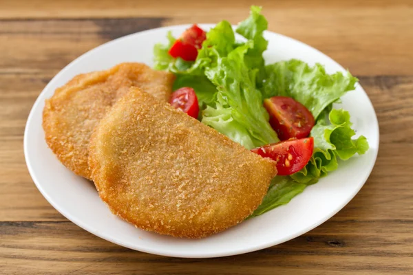 Portuguese meat cookies with fresh salad on white dish — Stock Photo, Image