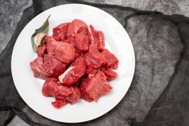 Fresh beef cut on white plate