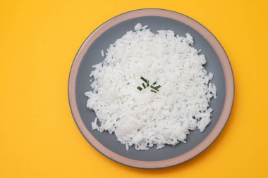 Boiled white rice on gray plate