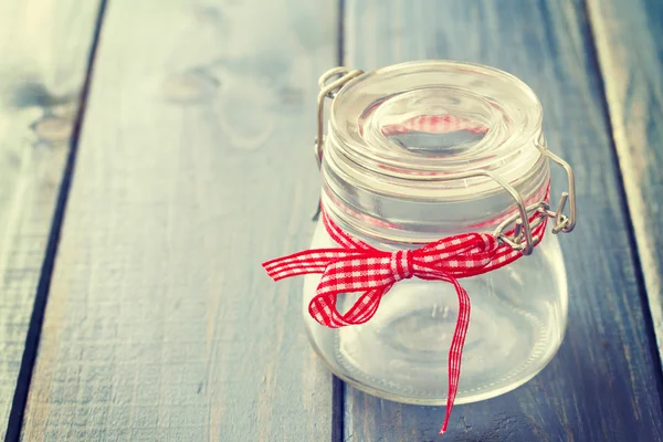 Empty jar on blue background — Stock Photo, Image