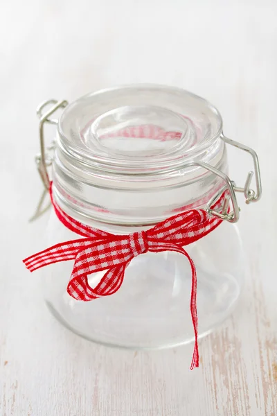 empty two glass jars on white wooden background