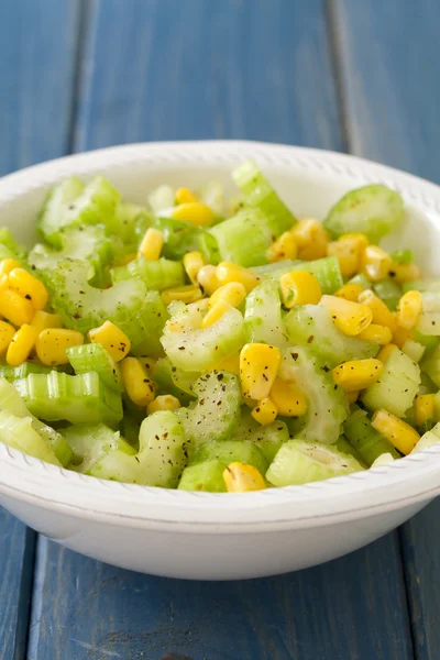 Salad celery with corn in white bowl — Stock Photo, Image