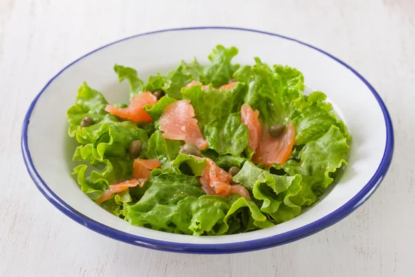 Salad with smoked salmon on plate — Stock Photo, Image