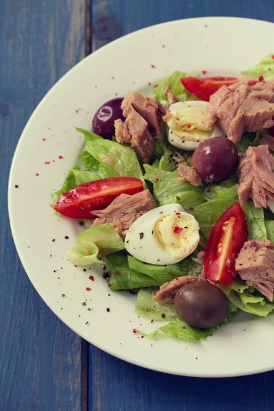 Fish salad on white plate — Stock Photo, Image