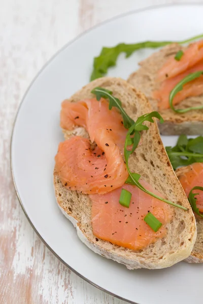 Toasts with smoked salmon — Stock Photo, Image