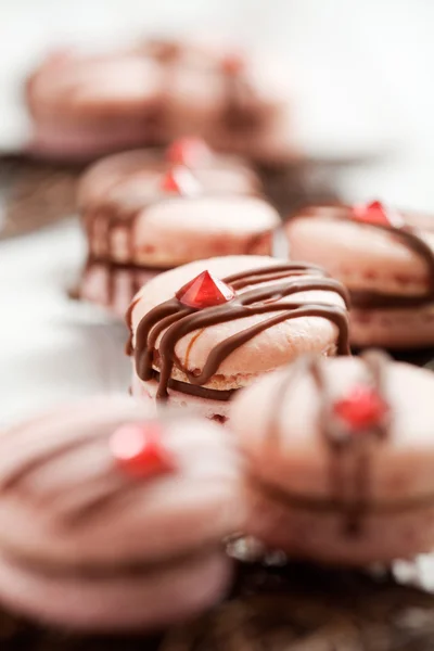 Pink macarons with chocolate — Stock Photo, Image