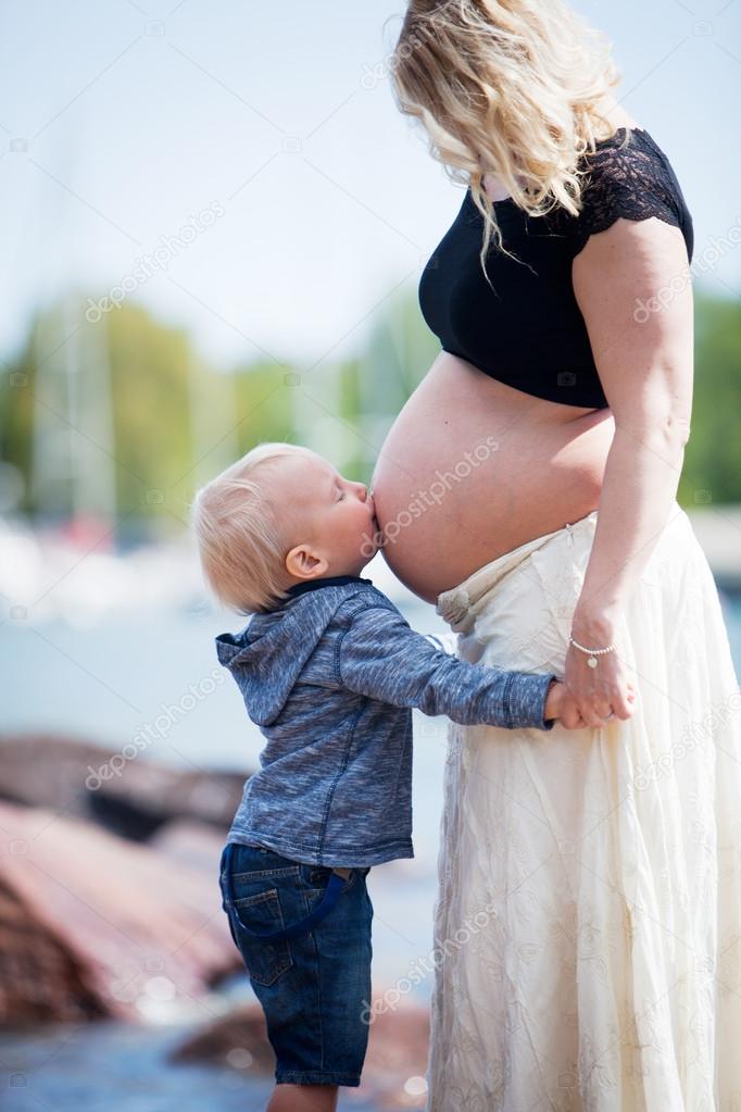 Pregnant mother with her son