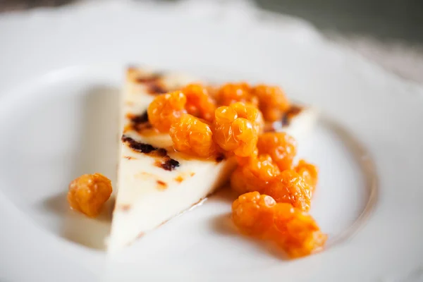 Cheese with fresh cloudberries — Stock Photo, Image