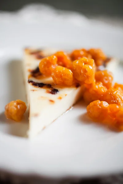 Cheese with fresh cloudberries — Stock Photo, Image