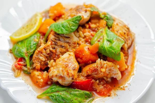 Chicken Jambalaya, cooked chicken breast pieces, in a spiced tomato sauce with chorizo, wholegrain rice, baby spinach, diced butternut squash and sliced red peppers, creole cuisine