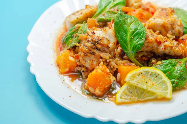 Chicken Jambalaya, cooked chicken breast pieces, in a spiced tomato sauce with chorizo, wholegrain rice, baby spinach, diced butternut squash and sliced red peppers, creole cuisine