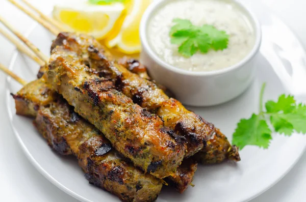 Pork shoulder kebabs with a lemon and herb rub and a garlic and mint yogurt sauce, shashlik