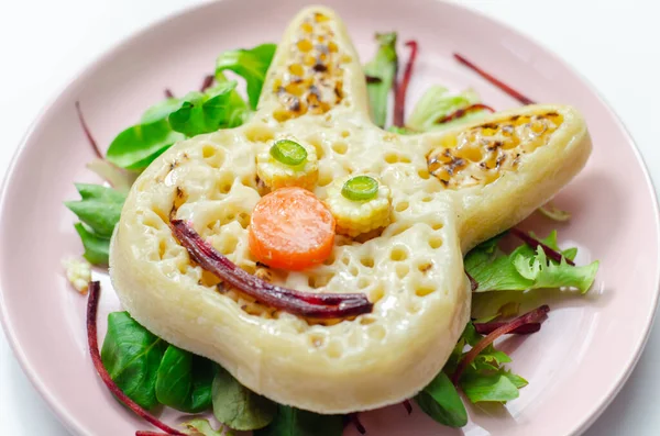 Funny and nice bunny shaped crumpets served with mix fresh vegetables, funny food for kids, healthy food