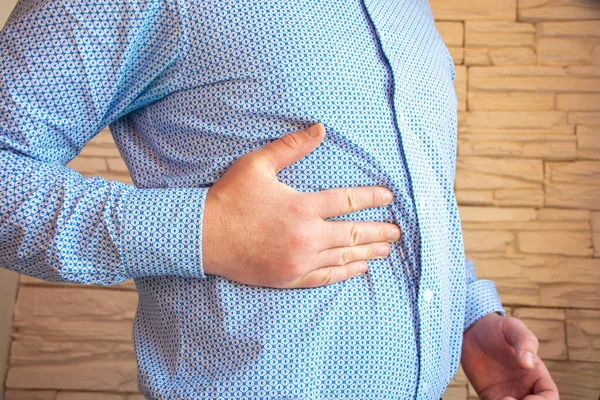 Persona Sostiene Mano Derecha Lado Derecho Del Cuerpo Área Del — Foto de Stock