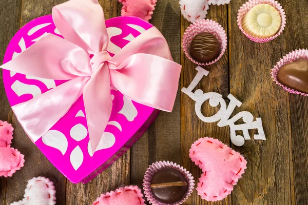 Chocolates in heart shaped box — Stock Photo, Image