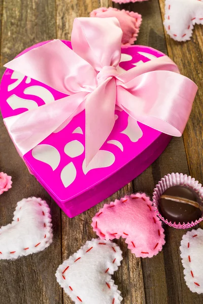 Chocolates in heart shaped box — Stock Photo, Image