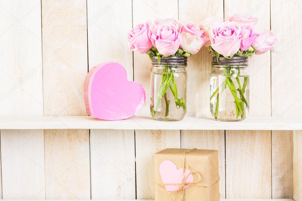 Bouquet with pink roses in mason jar