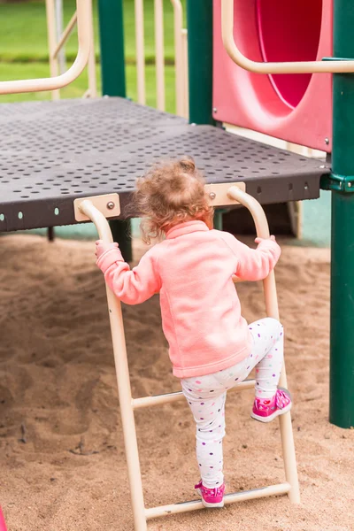 Toddler playing at the playground — Stock Photo, Image