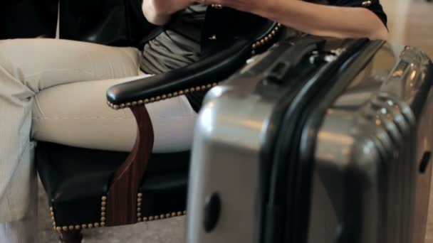 Woman with suitcase waiting for her train — Stock Video