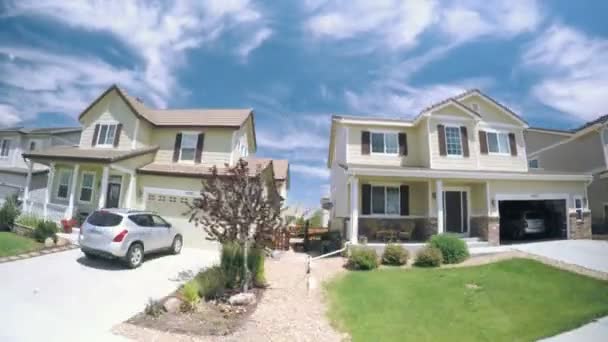 Car driving through residential neighborhood — Stock Video