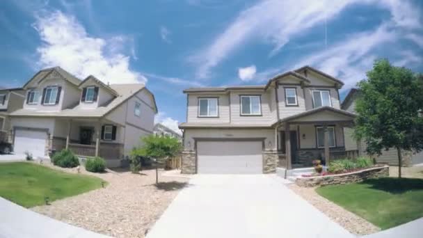 Car driving through residential neighborhood — Stock Video