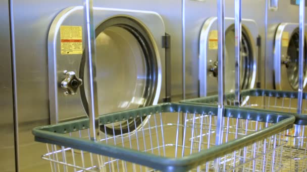 Industrial washing machines in a public laundromat. — Stock Video