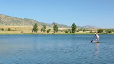 öğrenme kadın nasıl yapılır paddleboard 