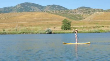 öğrenme kadın nasıl yapılır paddleboard 