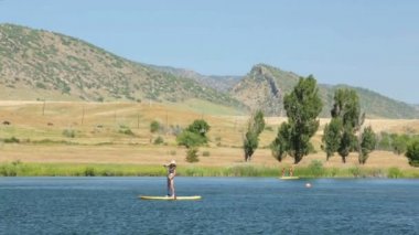 öğrenme kadın nasıl yapılır paddleboard 
